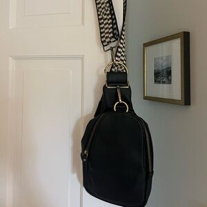 Anthropologie black sling bag in very good condition.